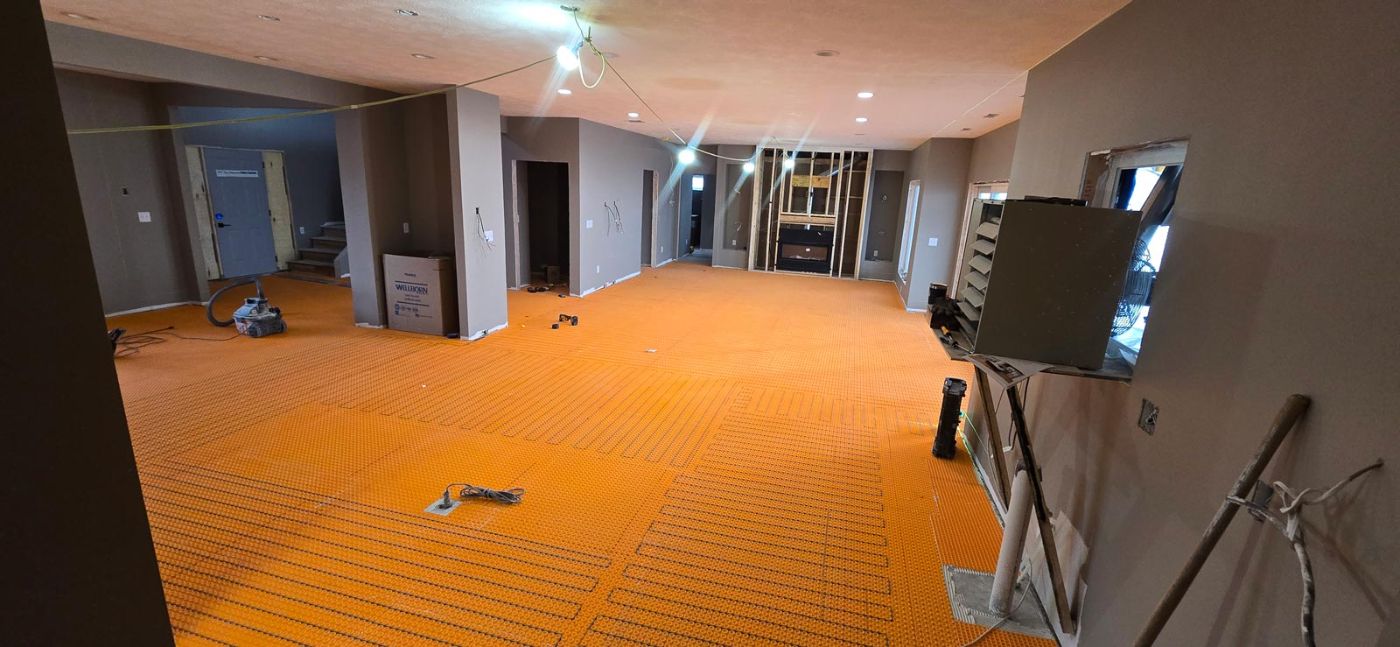 In-floor heat installation in a custom home lower level, Hahn Custom Homes